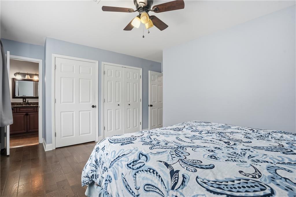 3320 Northcrest Road, Unit C Atlanta, GA 30340 - Photo 19 of 34 a bedroom with a bed and a chandelier