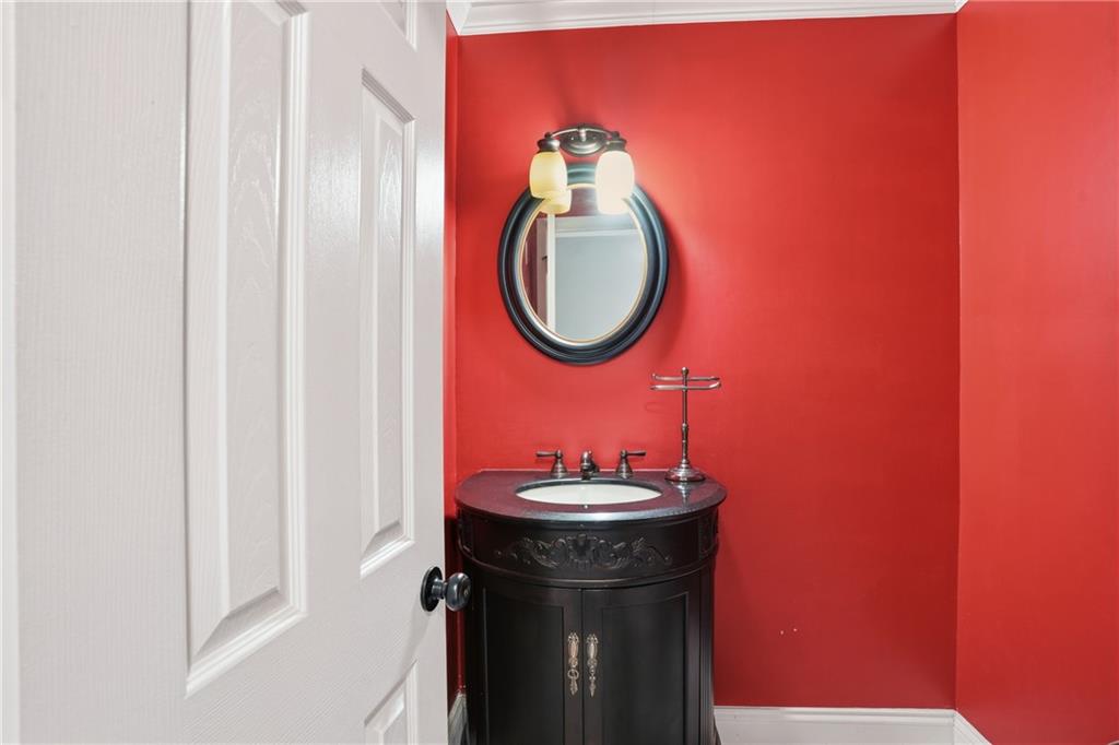 3320 Northcrest Road, Unit C Atlanta, GA 30340 - Photo 24 of 34 a bathroom with a sink and a mirror