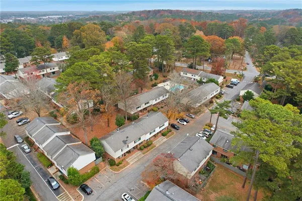 an aerial view of residential houses with outdoor space