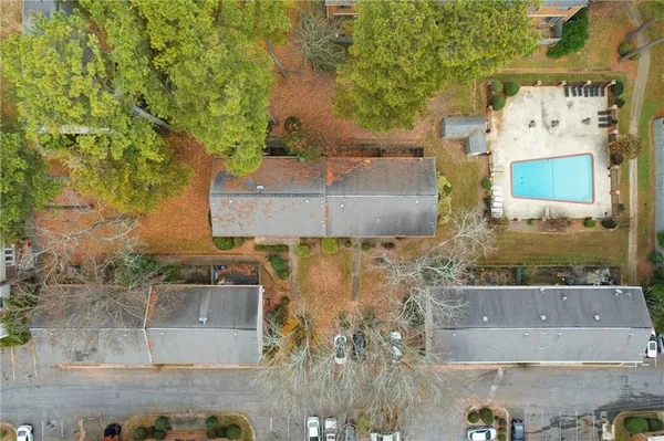 an aerial view of a house with a yard