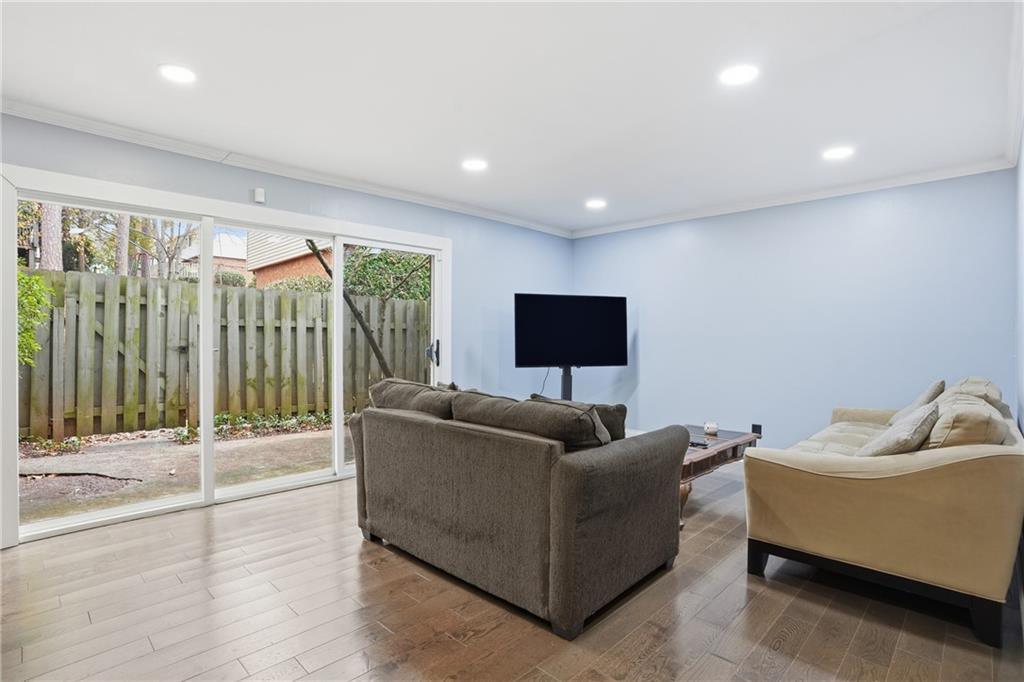3320 Northcrest Road, Unit C Atlanta, GA 30340 - Photo 6 of 34 a living room with furniture and a flat screen tv