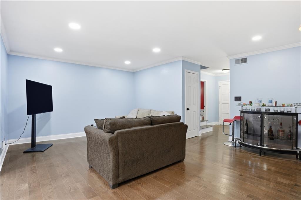 3320 Northcrest Road, Unit C Atlanta, GA 30340 - Photo 8 of 34 a living room with furniture and a wooden floor