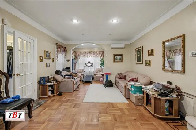 a living room with furniture window and a flat screen tv