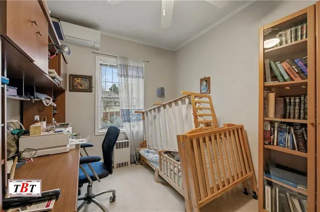 a view of hall way with furniture and windows