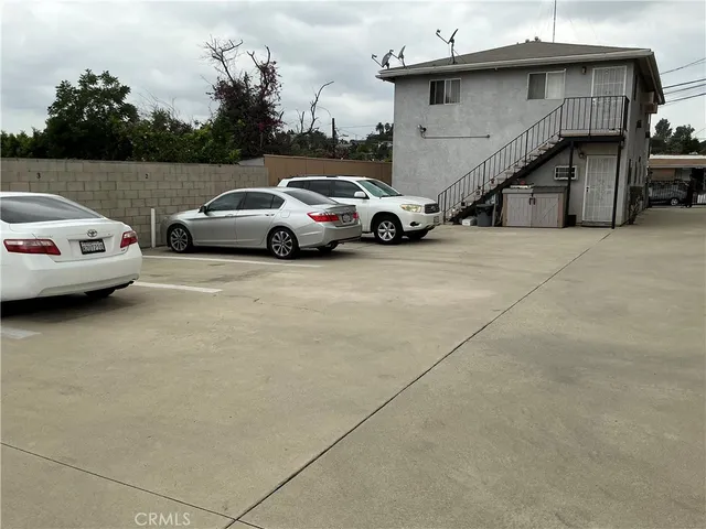 a view of a car parked in front of a house
