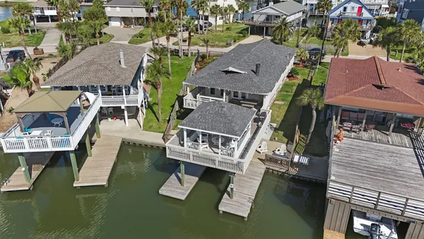 an aerial view of house with yard swimming pool and outdoor seating