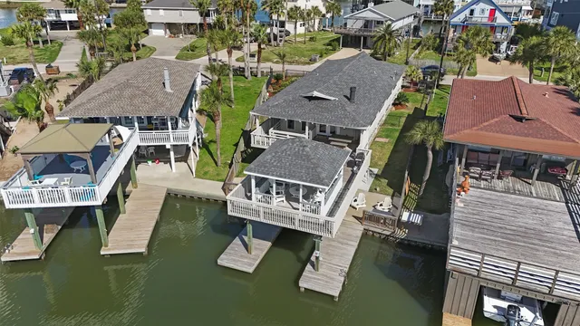 an aerial view of house with yard swimming pool and outdoor seating