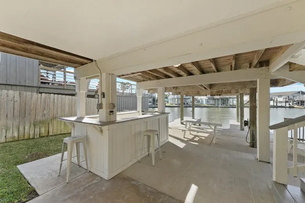 a view of a patio with a table and chairs