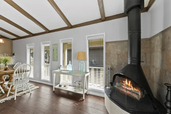 a view of an entryway with wooden floor and door