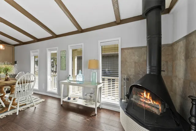 a view of an entryway with wooden floor and door