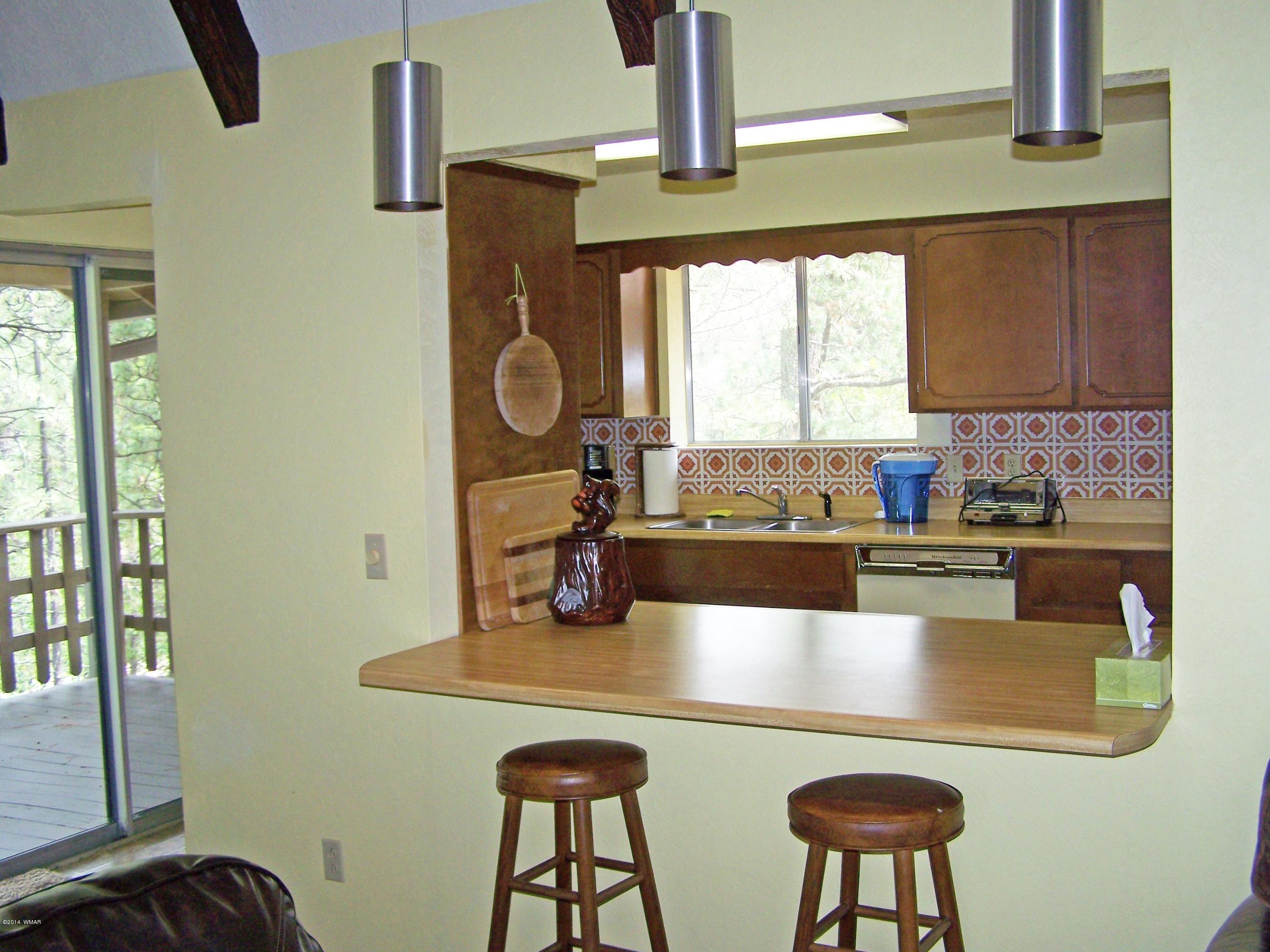 7 County Road 2135 Alpine, AZ 85920 - Photo 7 of 16 a kitchen with a table chairs and a window