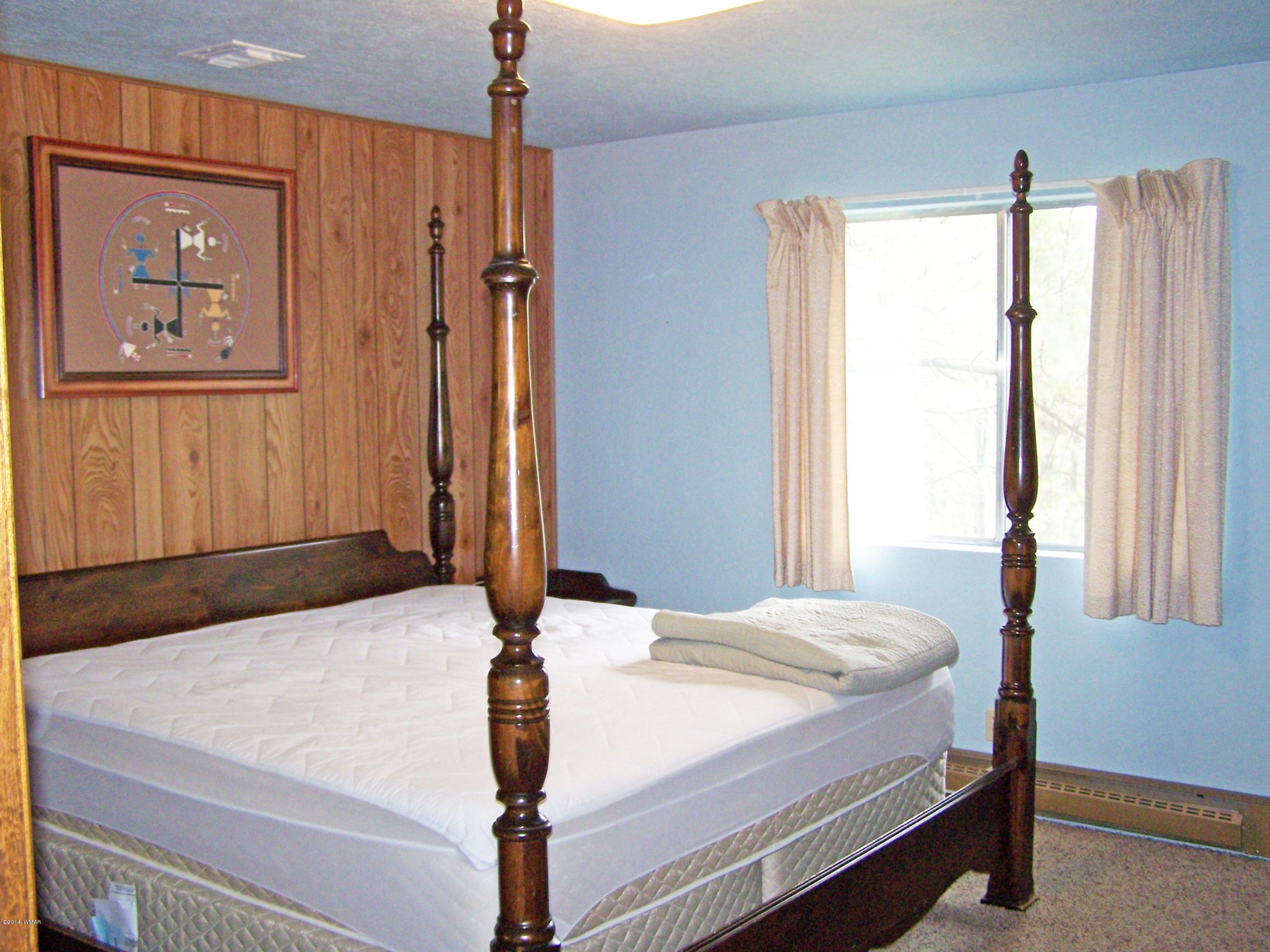 7 County Road 2135 Alpine, AZ 85920 - Photo 8 of 16 a bedroom with a bed and a window