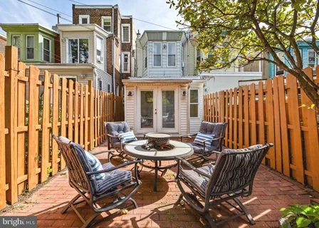 a view of a chair and table in the patio