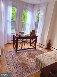 a view of a livingroom with furniture and window