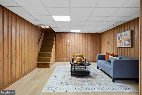 a living room with furniture and a rug