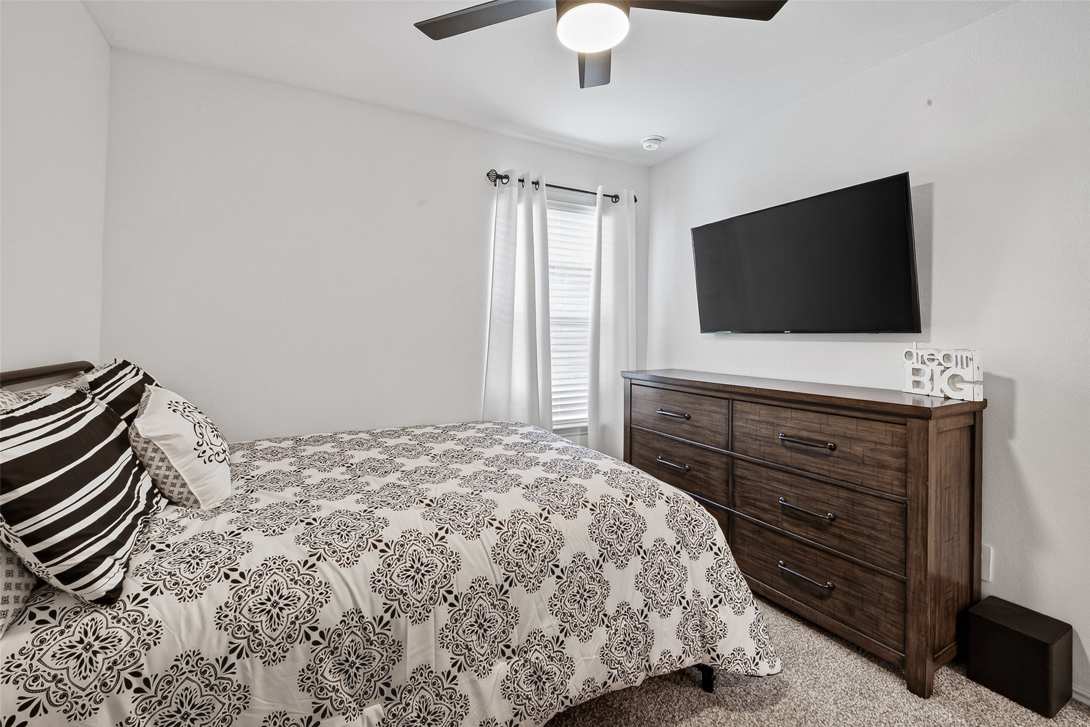 24318 Pebble Crescent Ln Spring Spring, TX 77373 - Photo 23 of 30 Spacious secondary bedroom featuring great natural light, ample closet space, and versatile functionality perfect for family, guests, a home office, or flex space.