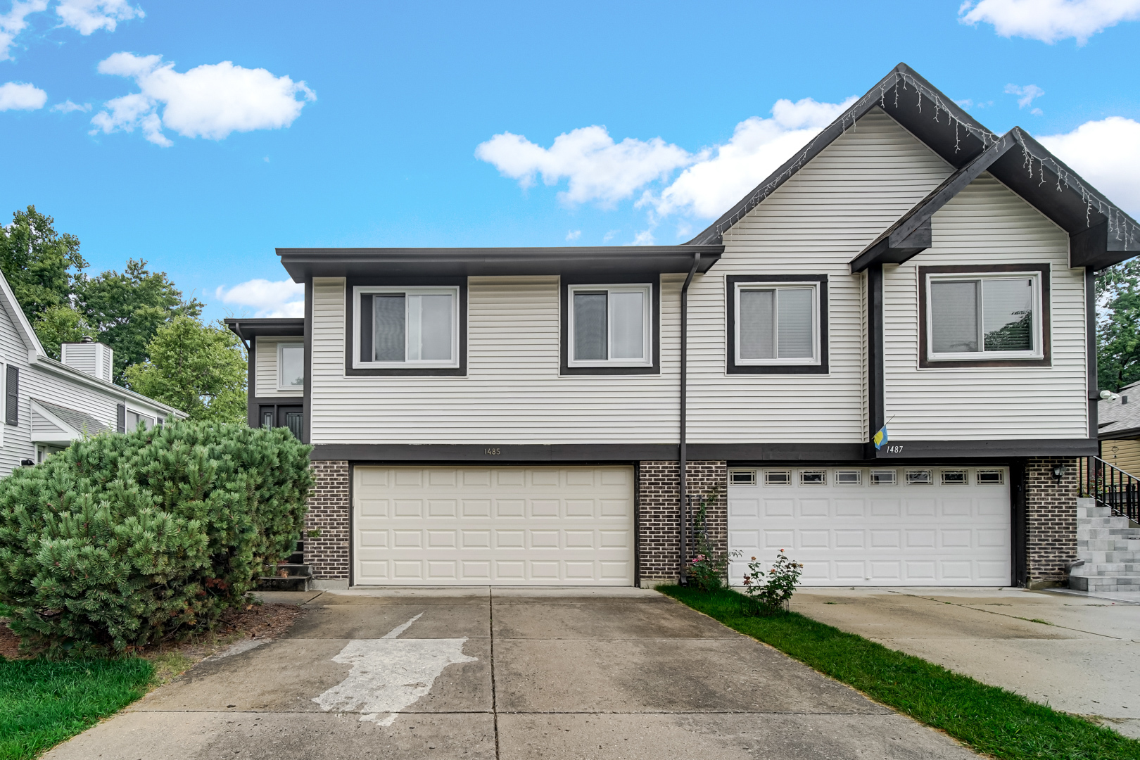 a front view of a house with yard