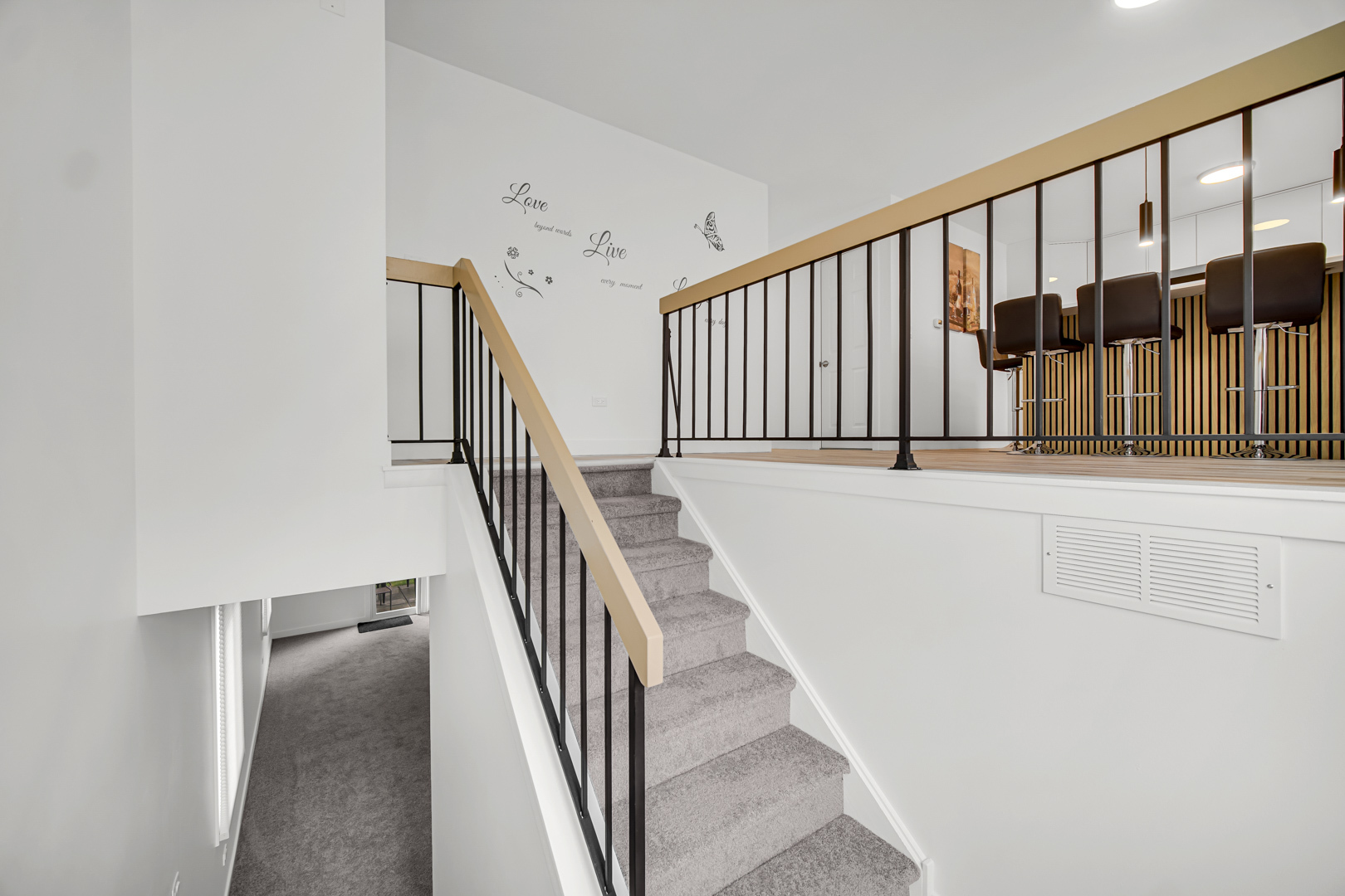 1485 Chippewa Trail Wheeling, IL 60090 - Photo 13 of 16 a view of staircase with railing and white walls