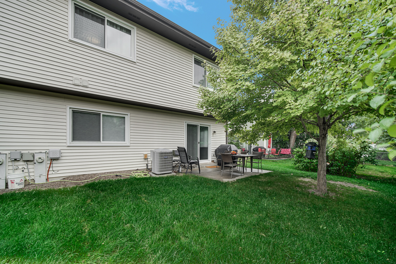 1485 Chippewa Trail Wheeling, IL 60090 - Photo 16 of 16 a front view of house with yard and outdoor seating