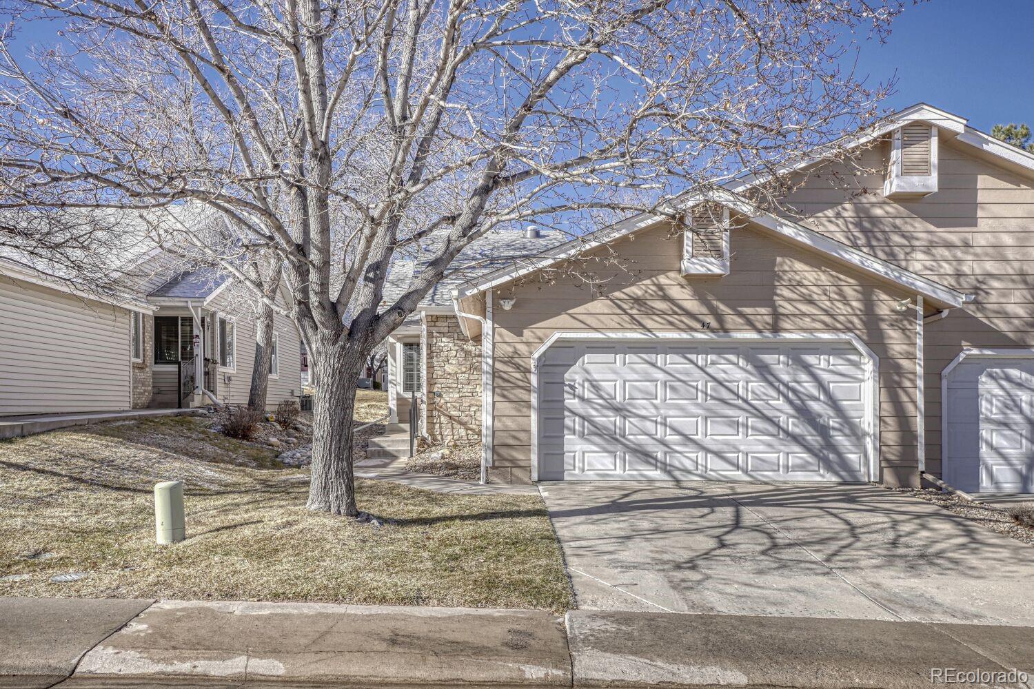 47 Canongate Lane Highlands Ranch, CO 80130 - Photo 1 of 22 a front view of a house with a yard