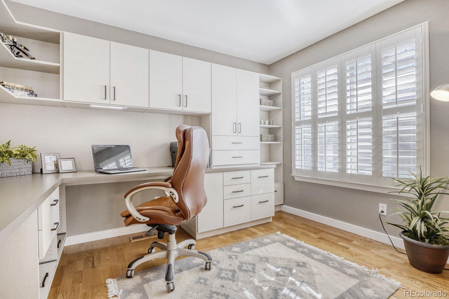 47 Canongate Lane Highlands Ranch, CO 80130 - Photo 17 of 22 a view of a workspace with furniture and a window