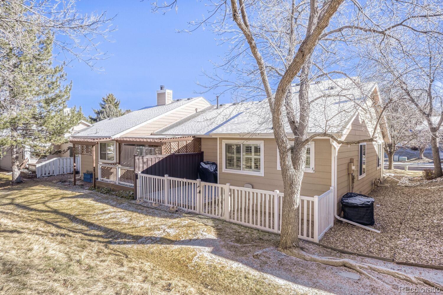 47 Canongate Lane Highlands Ranch, CO 80130 - Photo 21 of 22 a view of a house with a yard covered in snow