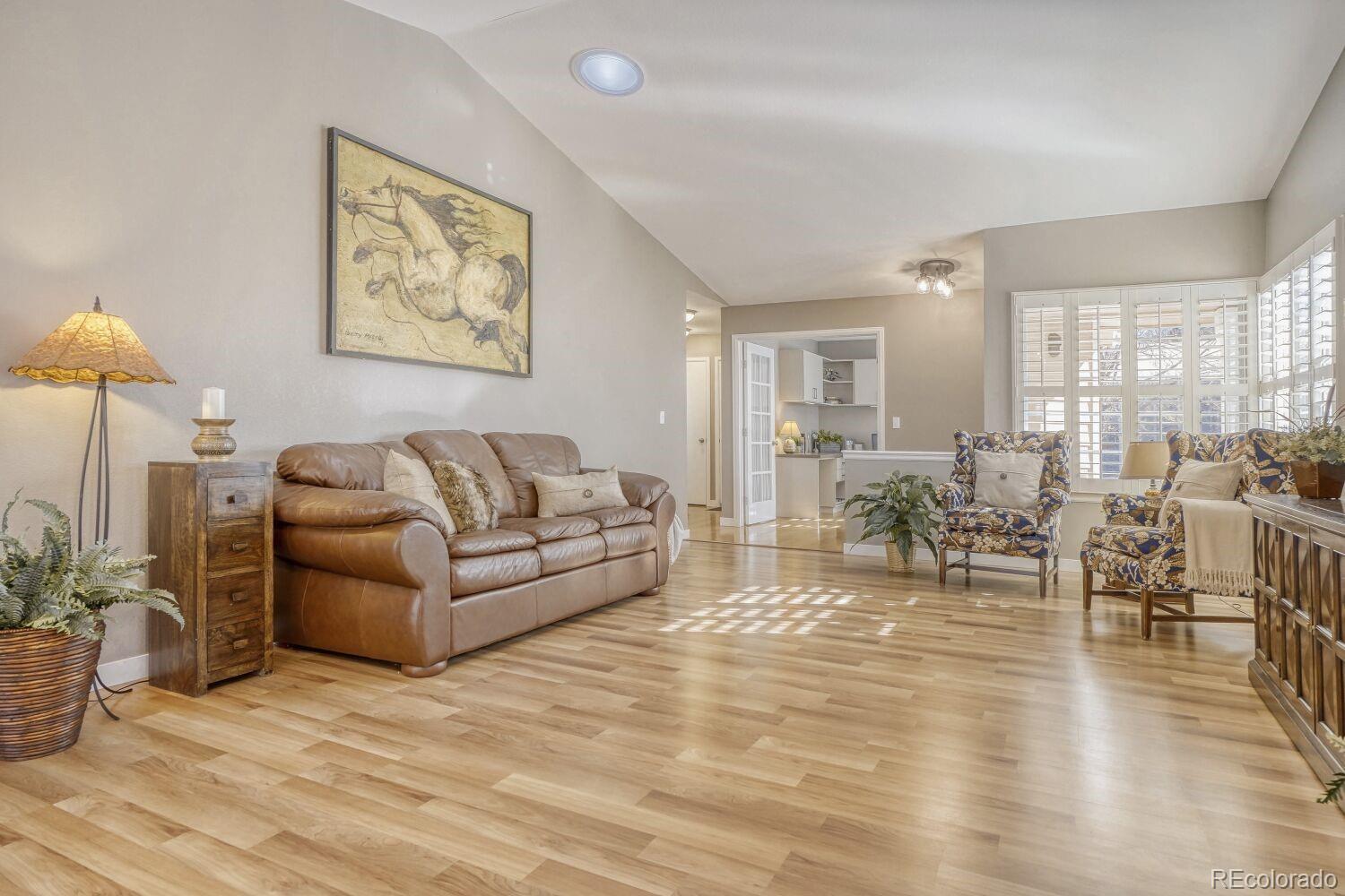 47 Canongate Lane Highlands Ranch, CO 80130 - Photo 6 of 22 a living room with furniture and a table