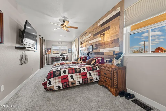 a living room with lots of furniture and a flat screen tv