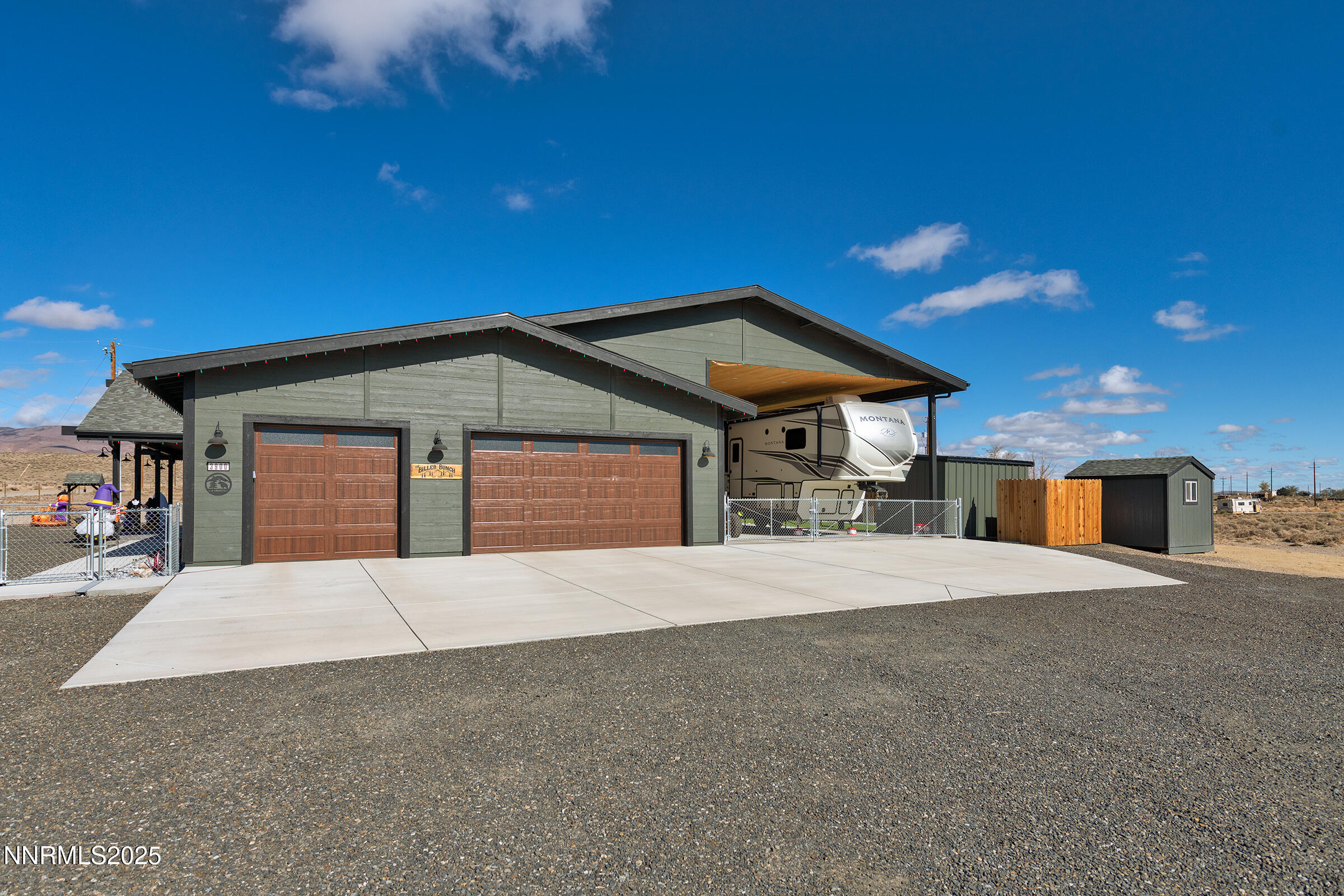 3900 Hackberry Street Silver Springs, NV 89429 - Photo 5 of 30 a front view of a house with a yard and garage