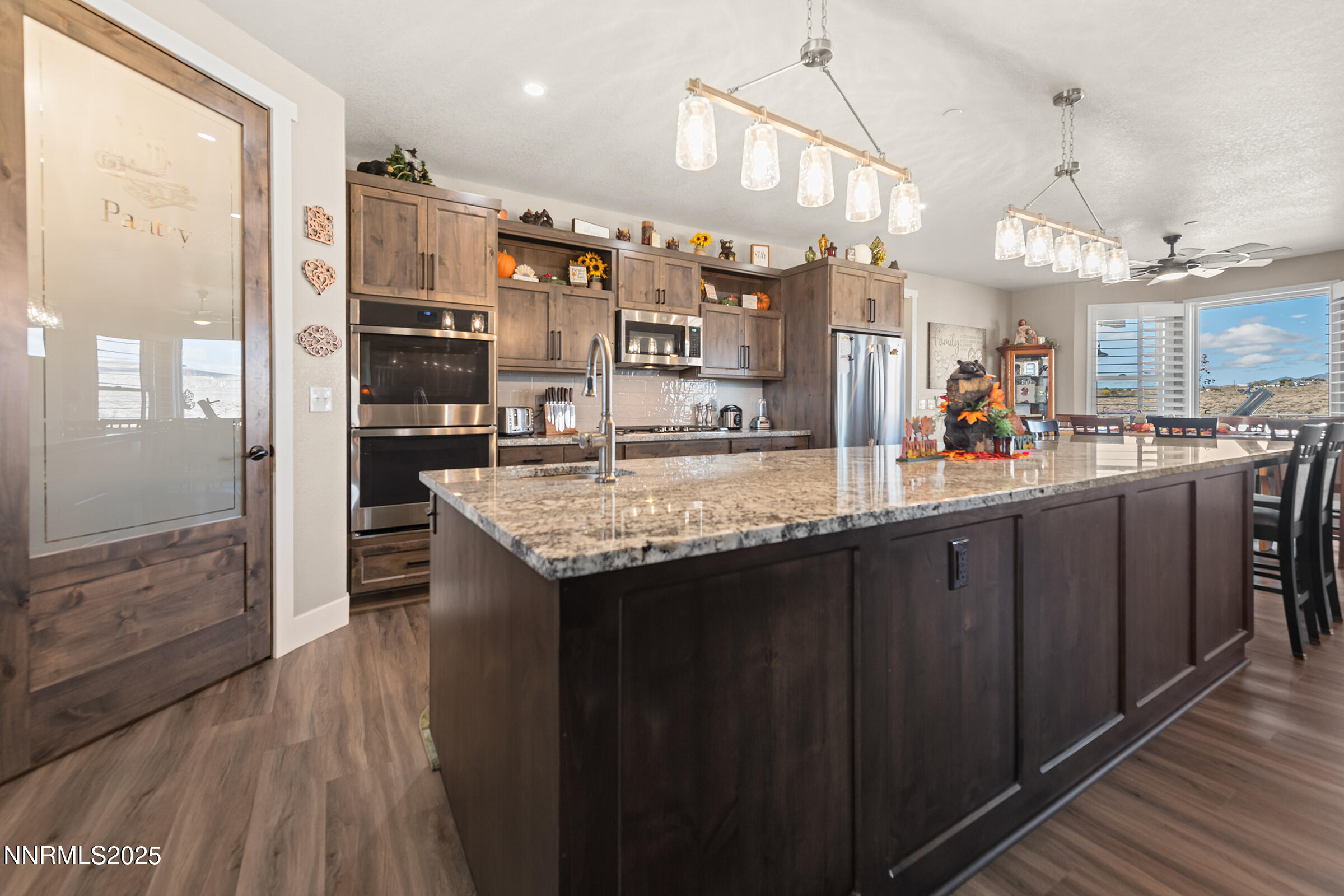 3900 Hackberry Street Silver Springs, NV 89429 - Photo 7 of 30 a kitchen with granite countertop a sink and cabinets