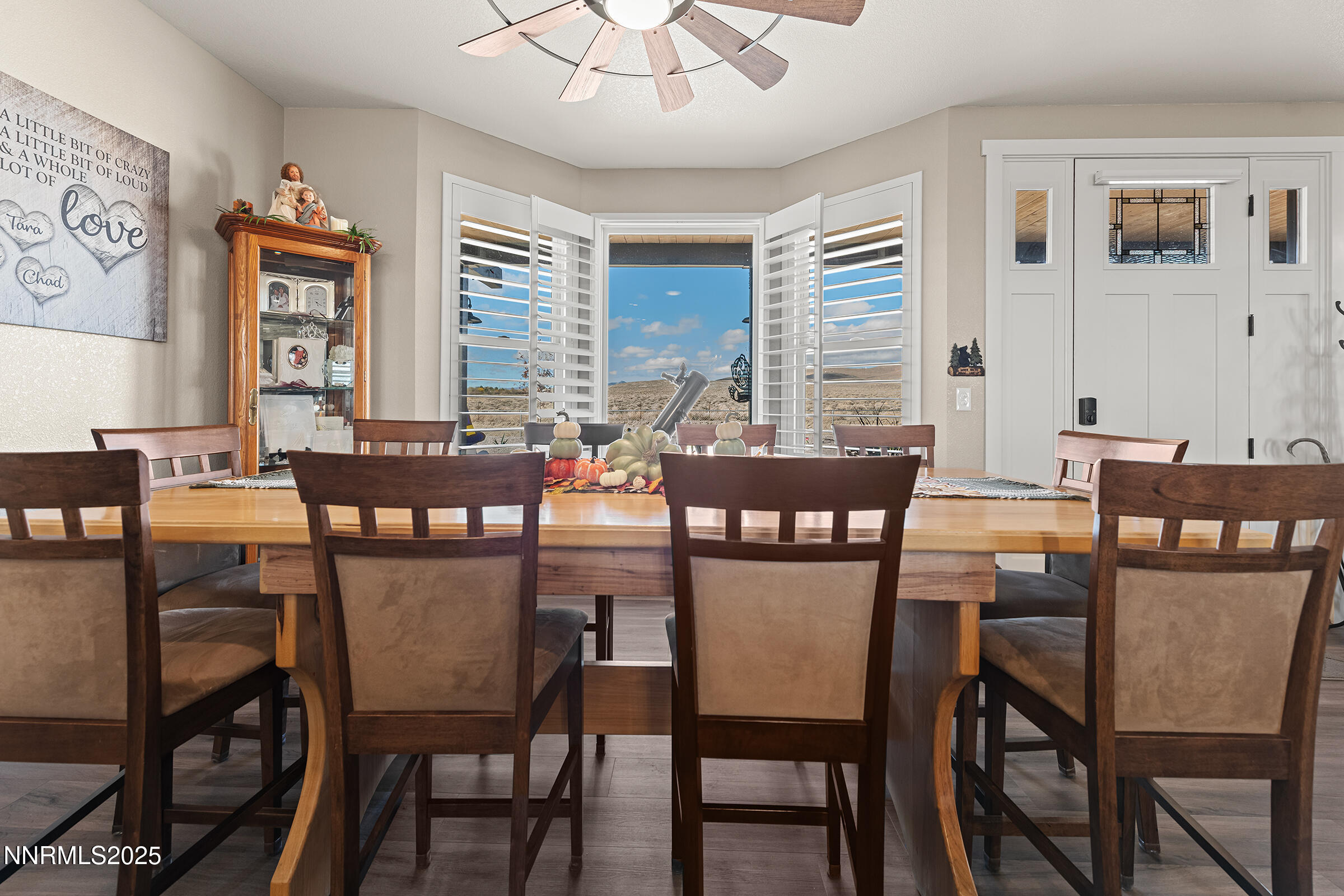 3900 Hackberry Street Silver Springs, NV 89429 - Photo 10 of 30 a dining room with furniture a large window and wooden floor