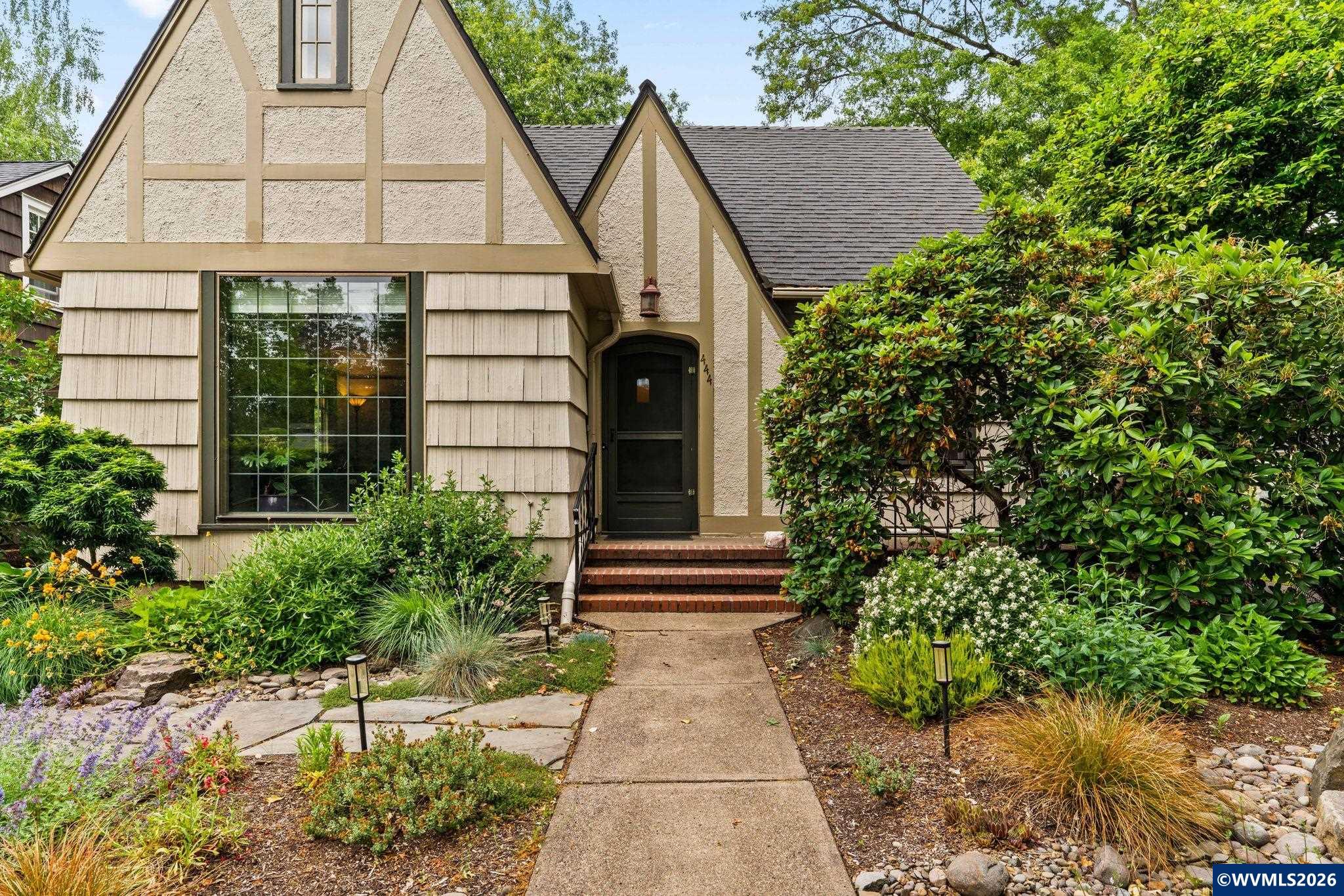 444 Northwest 35th Street Corvallis, OR 97330 - Photo 5 of 40 a front view of a house with a garden