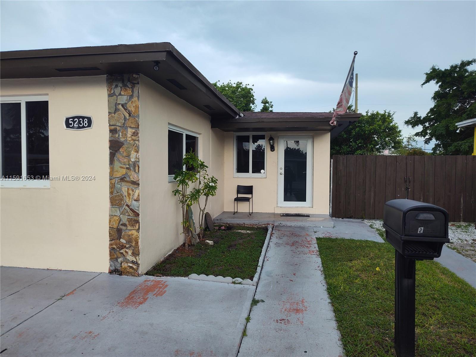Flagami Miami, FL 33126 - Photo 2 of 3 a front view of a house with a garden