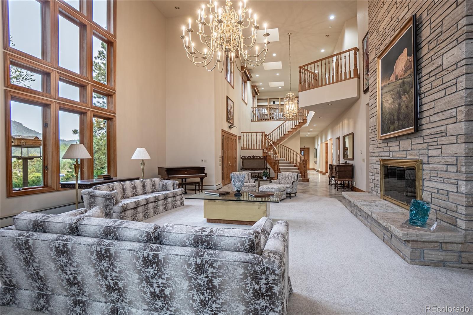 3282 Tomah Road Larkspur, CO 80118 - Photo 17 of 35 a view of a living room and a chandelier