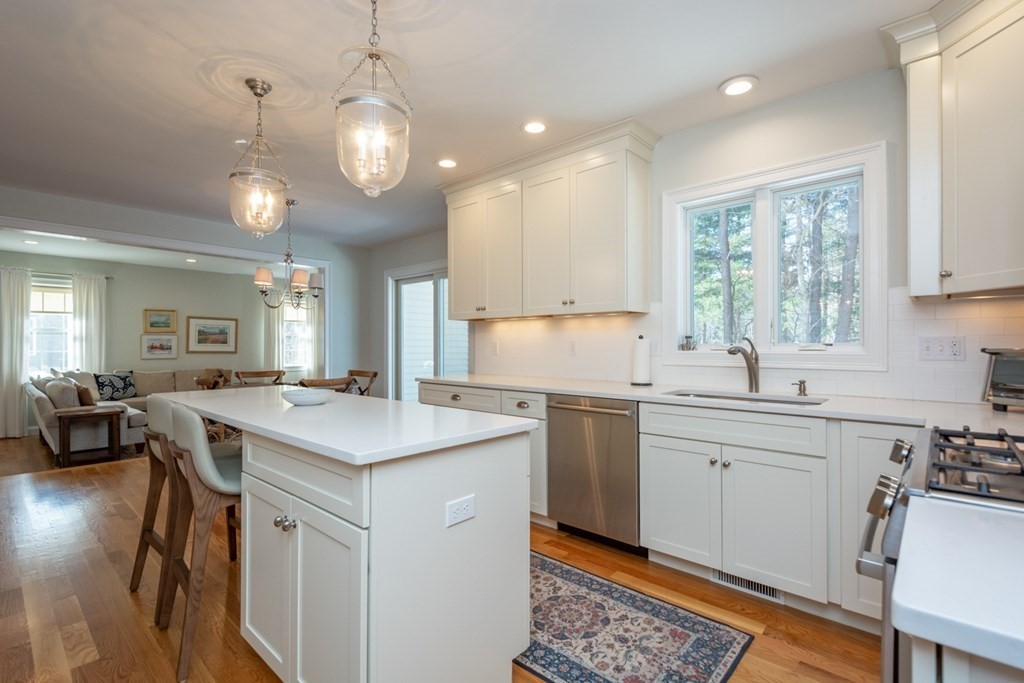 7 July Road Sudbury, MA 01776 - Photo 4 of 41 a kitchen with sink stove and cabinets
