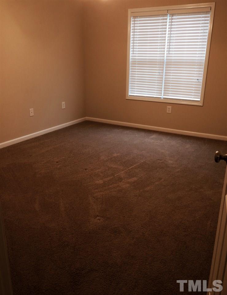 4112 Wyrick Court Raleigh, NC 27604 - Photo 12 of 18 an empty room with a window