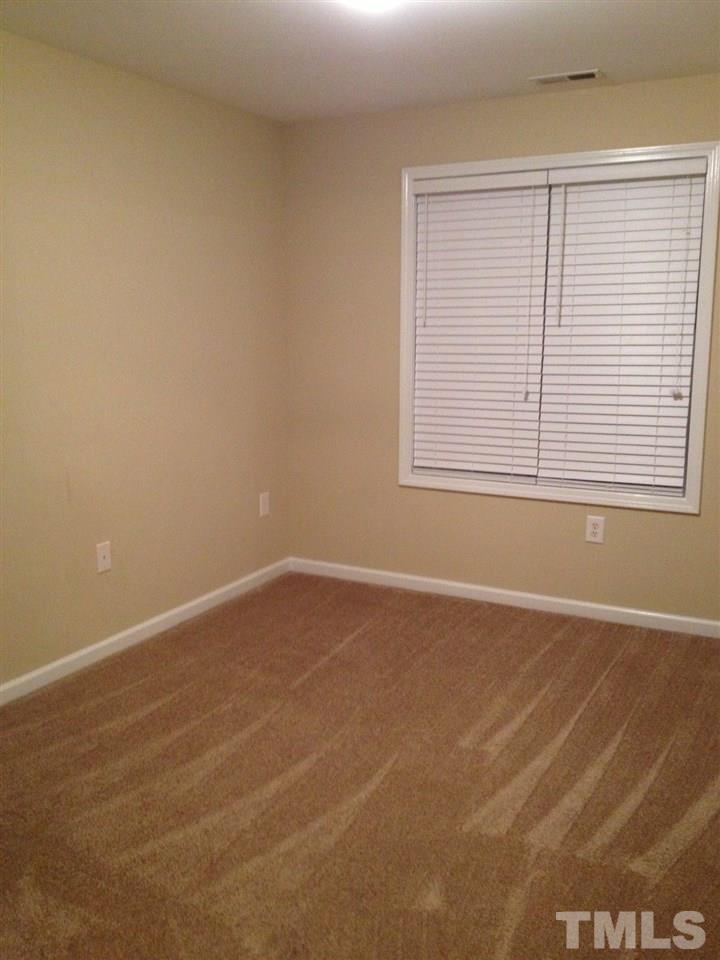4112 Wyrick Court Raleigh, NC 27604 - Photo 14 of 18 an empty room with a window