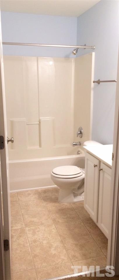 4112 Wyrick Court Raleigh, NC 27604 - Photo 15 of 18 a bathroom with a toilet a sink and a bathtub