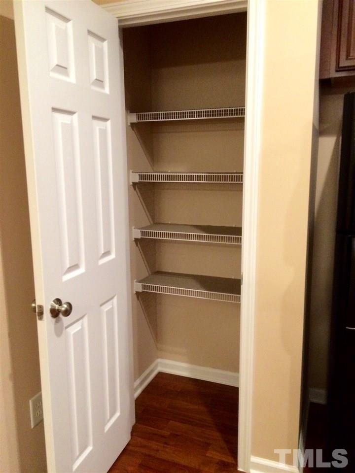 4112 Wyrick Court Raleigh, NC 27604 - Photo 3 of 18 a view of walk in closet with empty racks