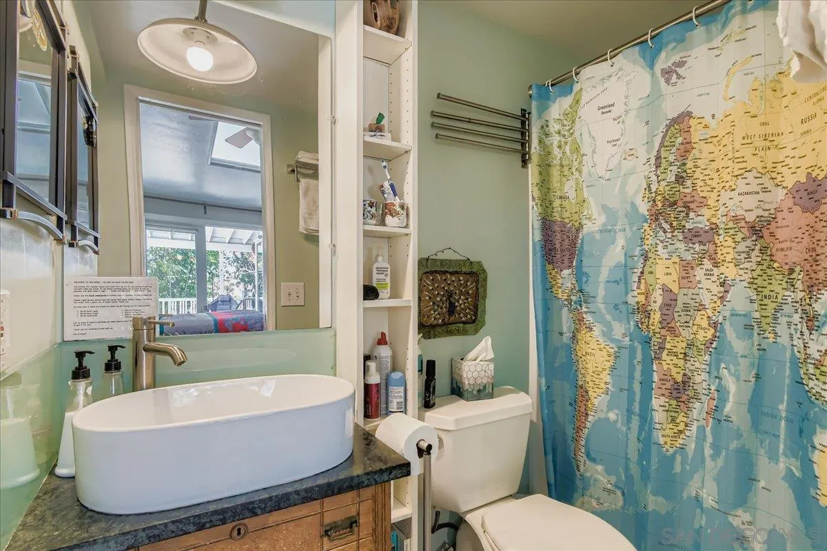3275 East Virgo Road San Diego, CA 92105 - Photo 17 of 38 a white bath tub sitting next to a white toilet