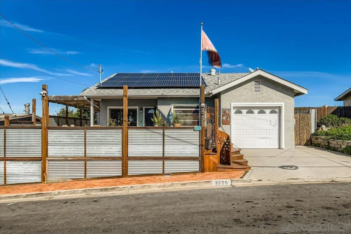 3275 East Virgo Road San Diego, CA 92105 - Photo 2 of 38 a front view of a house with a garden