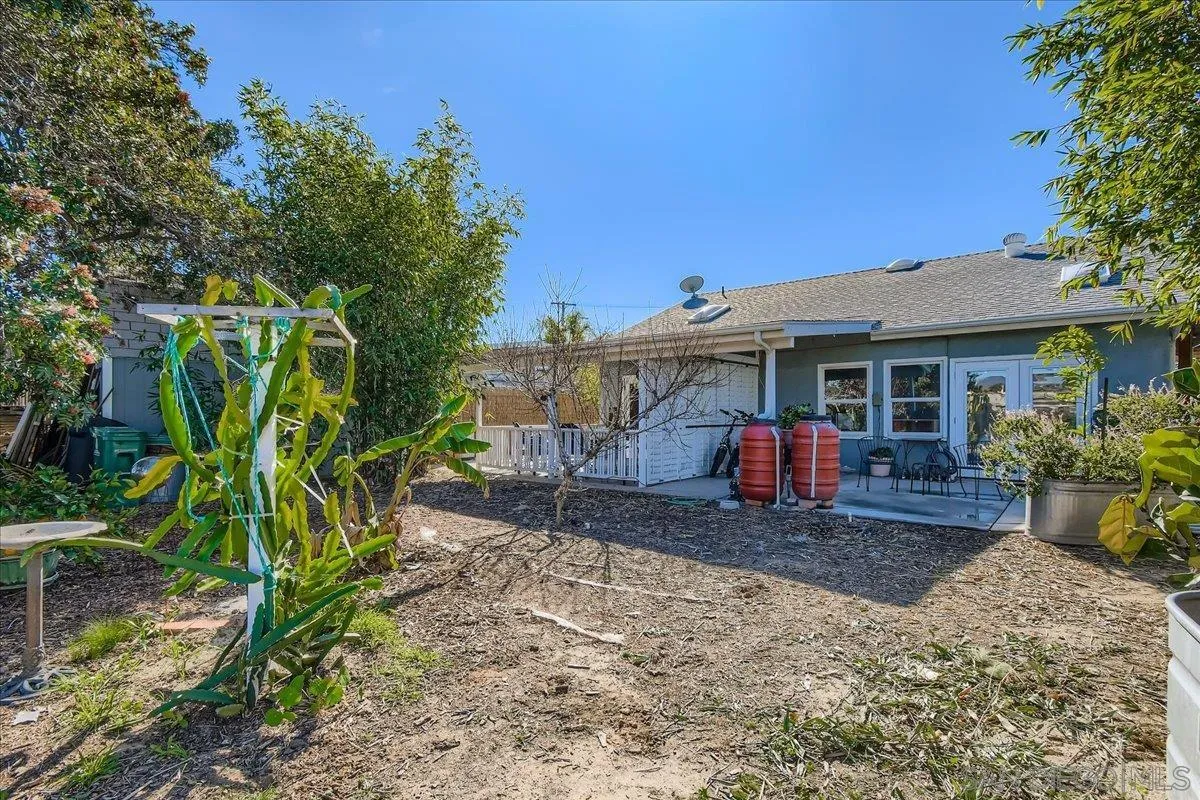 3275 East Virgo Road San Diego, CA 92105 - Photo 23 of 38 a view of a house with a yard and sitting area