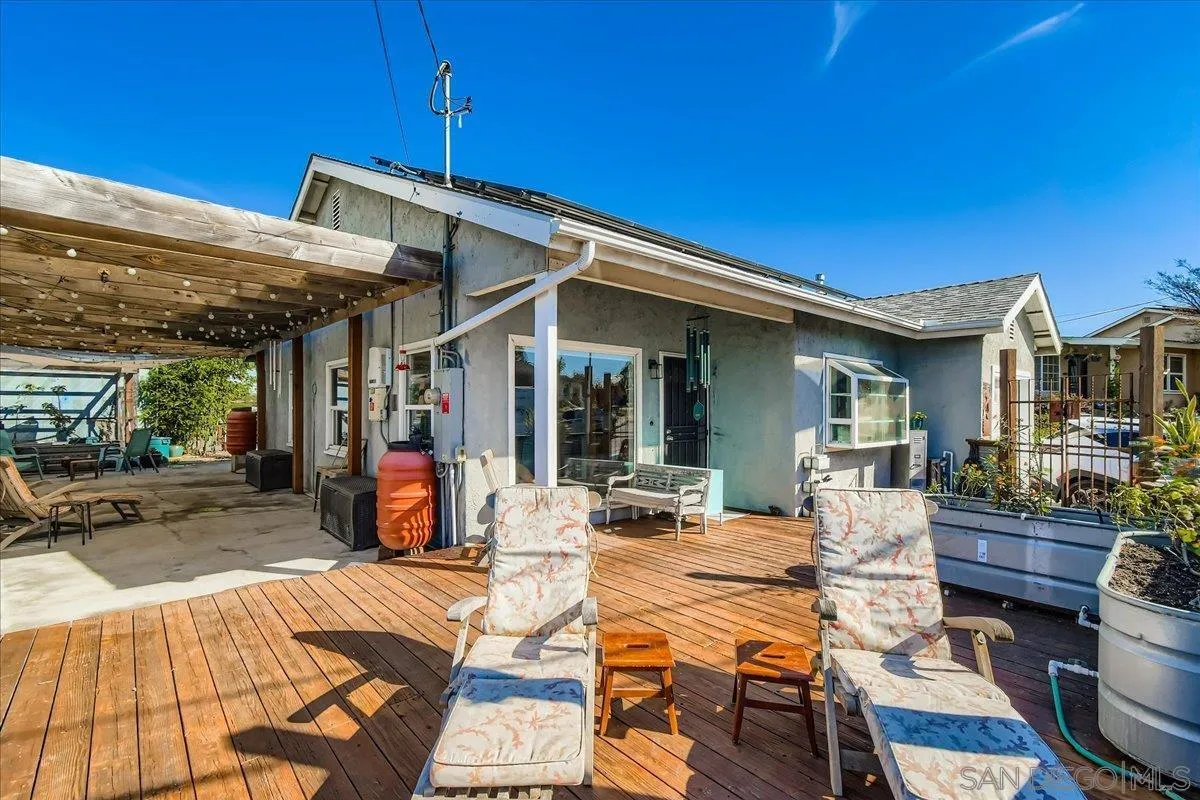 3275 East Virgo Road San Diego, CA 92105 - Photo 3 of 38 a view of a patio with table and chairs near a barbeque