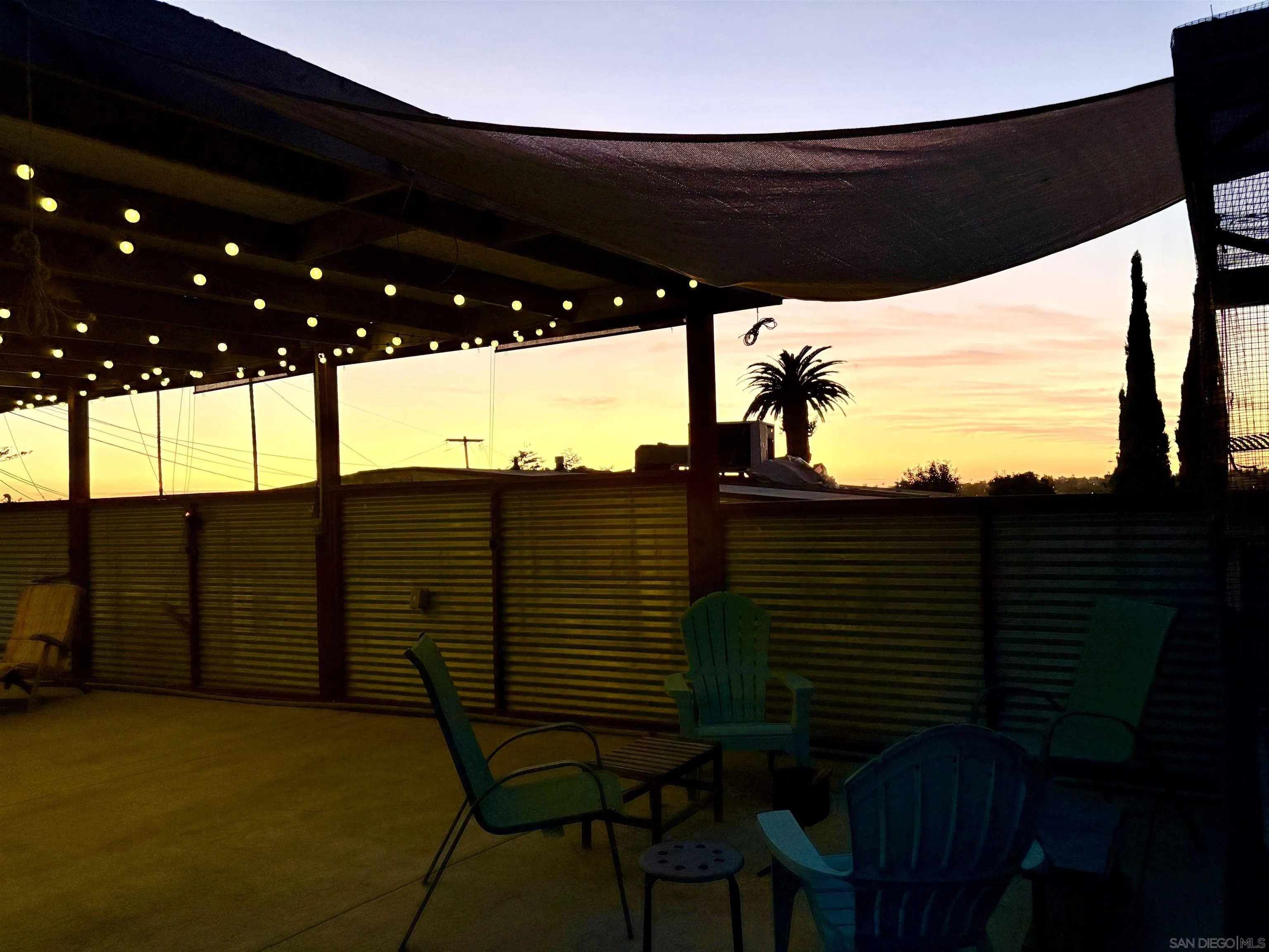 3275 East Virgo Road San Diego, CA 92105 - Photo 36 of 38 a terrace of a building with table and chairs