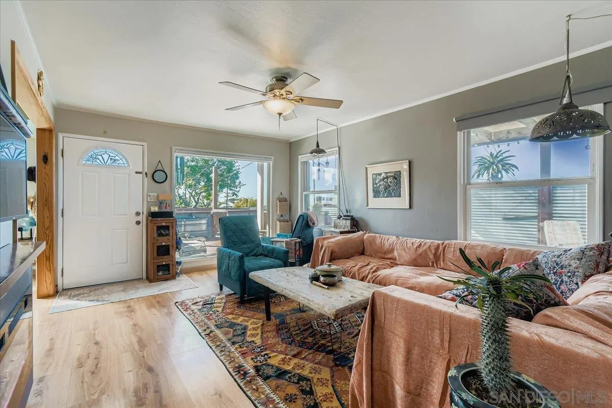 3275 East Virgo Road San Diego, CA 92105 - Photo 6 of 38 a living room with furniture and a large window