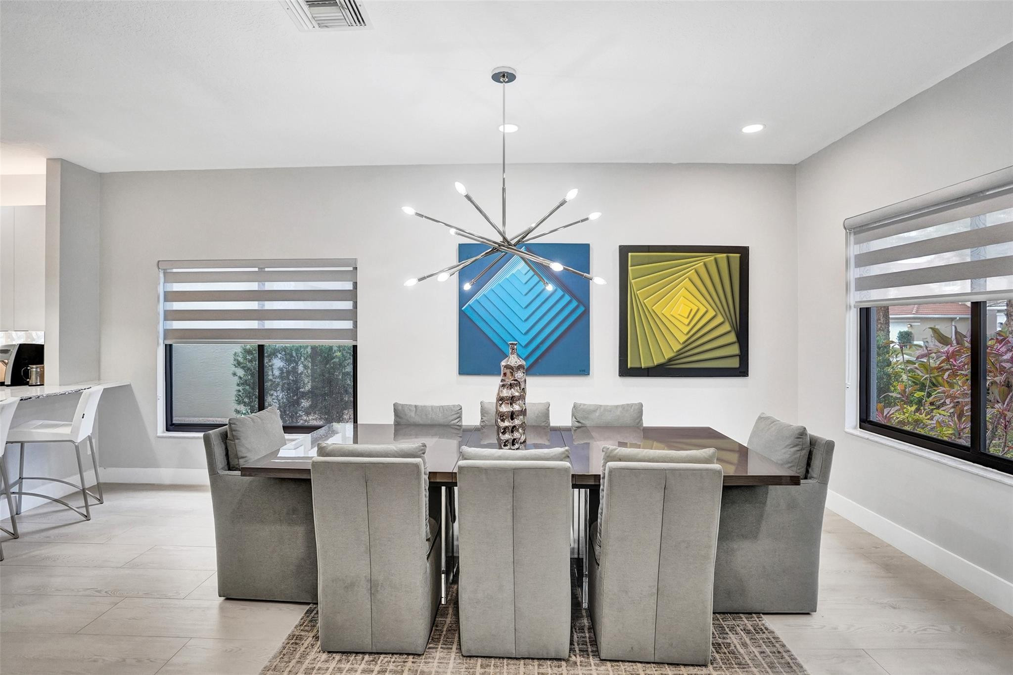 551 Anchor Point Delray Beach, FL 33444 - Photo 11 of 46 a dining room with chandelier windows and furniture