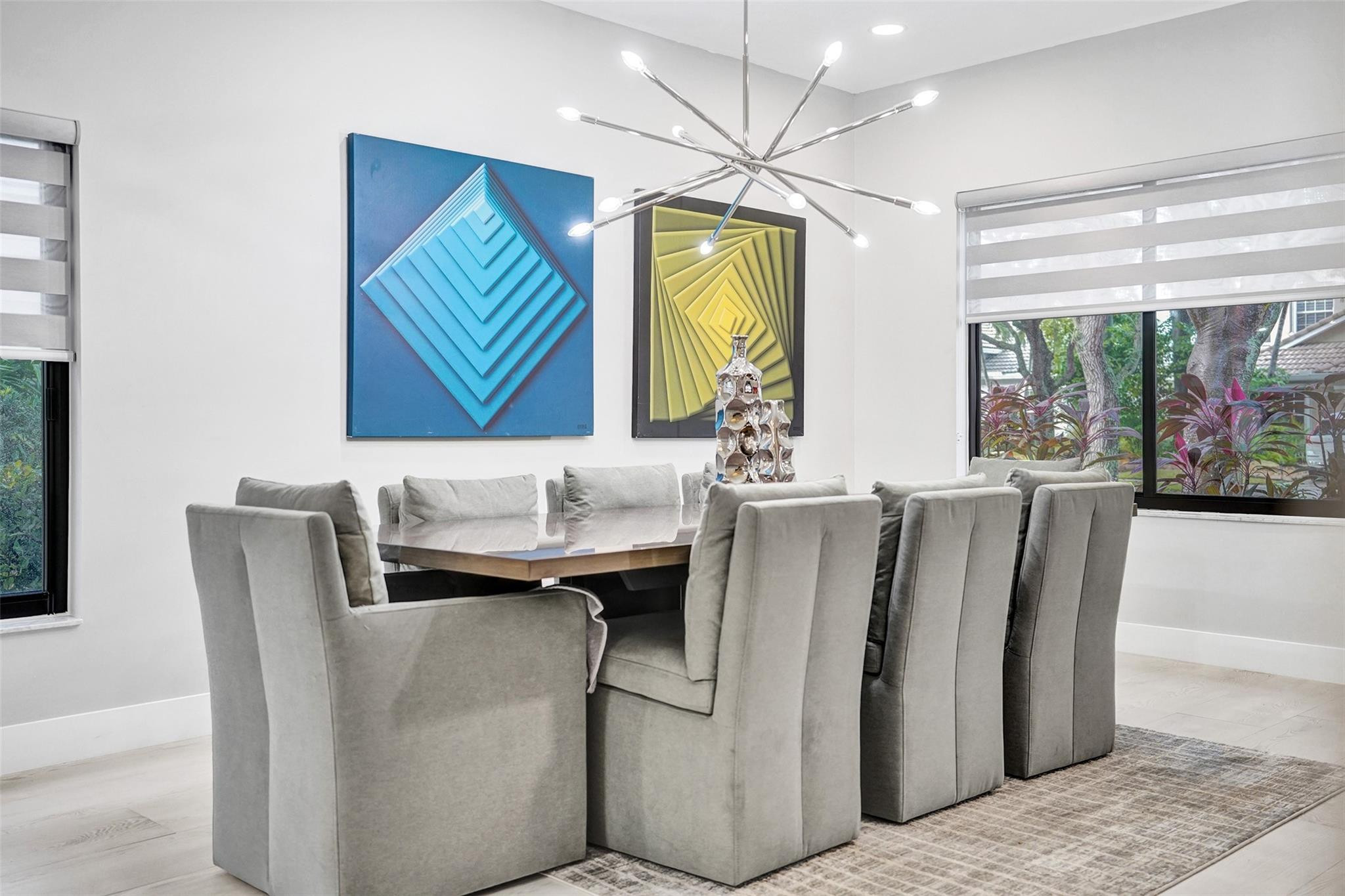 551 Anchor Point Delray Beach, FL 33444 - Photo 12 of 46 a living room with furniture and a chandelier