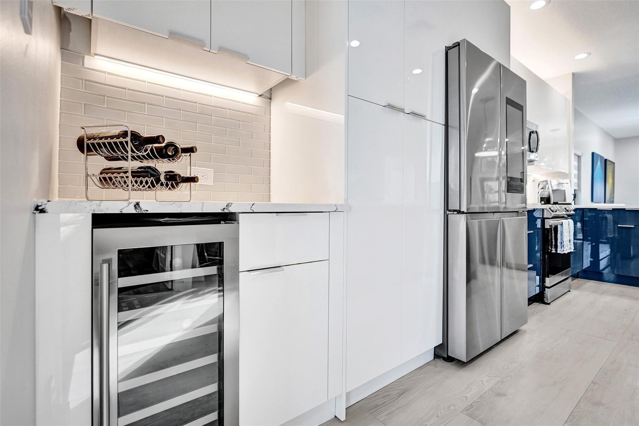 551 Anchor Point Delray Beach, FL 33444 - Photo 21 of 46 a kitchen with stainless steel appliances granite countertop a refrigerator and a sink
