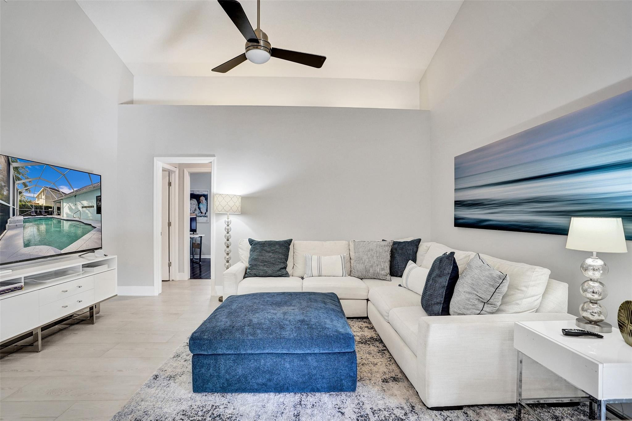 551 Anchor Point Delray Beach, FL 33444 - Photo 23 of 46 a living room with furniture and a flat screen tv