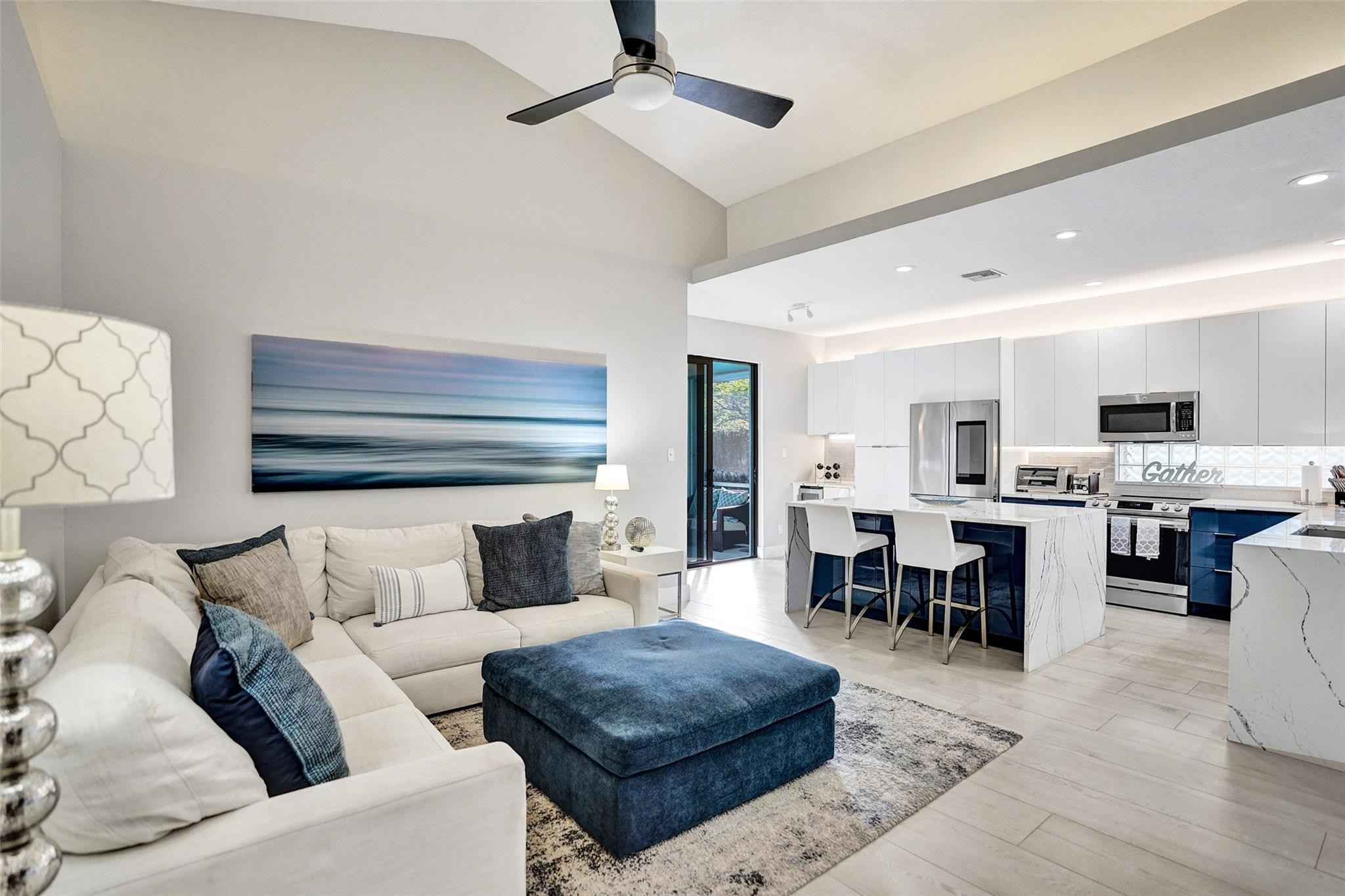551 Anchor Point Delray Beach, FL 33444 - Photo 25 of 46 a living room with furniture kitchen view and a chandelier